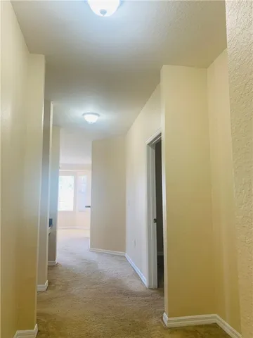 a view of hallway with a room