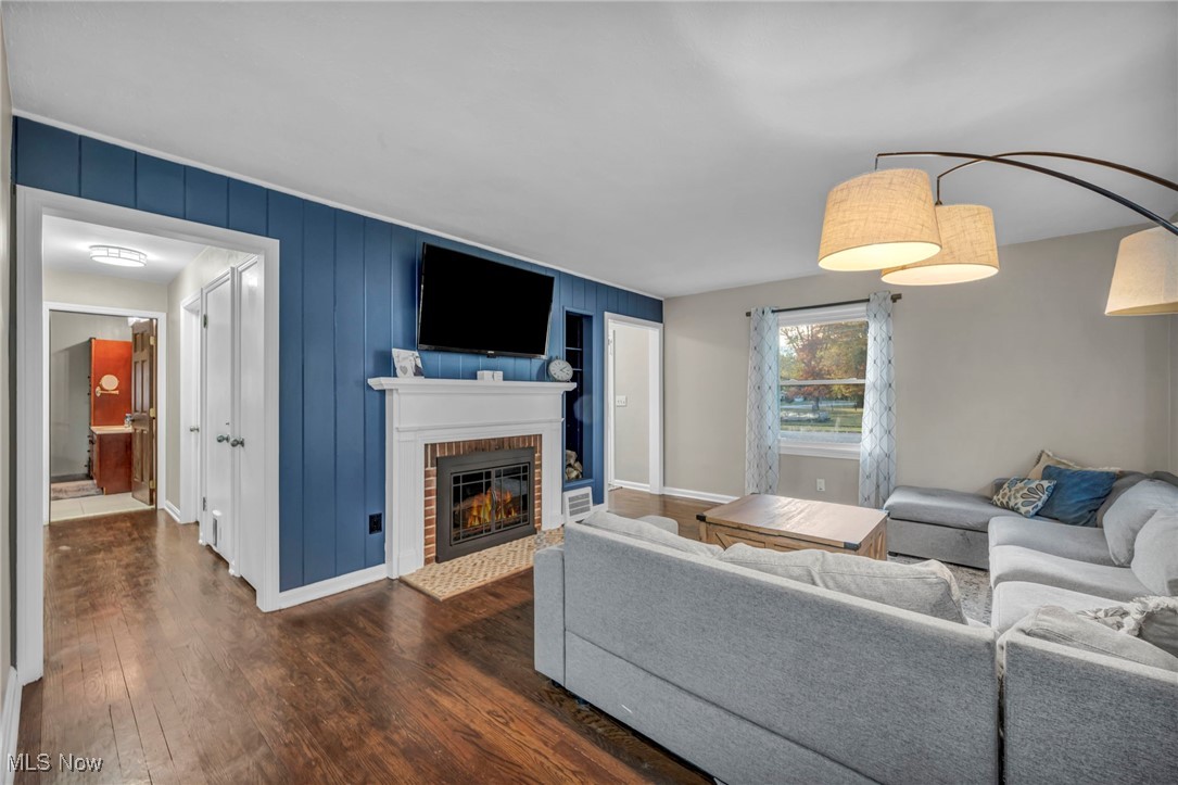 149 Jaycox Road Avon Lake, OH 44012 - Photo 21 of 42 Living area with dark wood finished floors and a fireplace