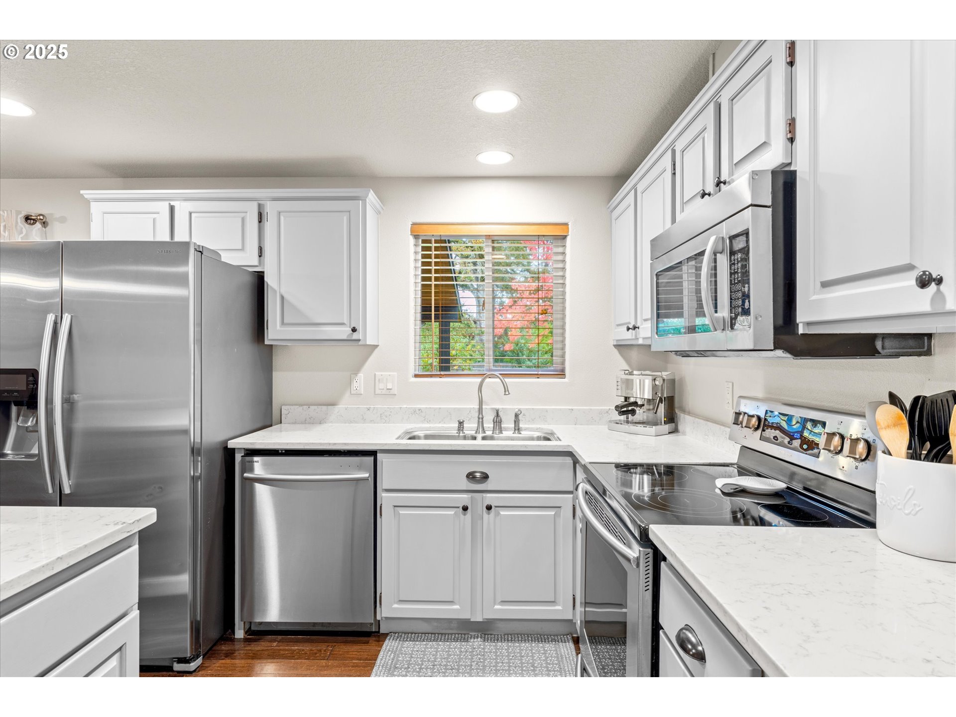 3019 Brooke Street Forest Grove, OR 97116 - Photo 11 of 34 a kitchen with a sink a refrigerator and cabinets