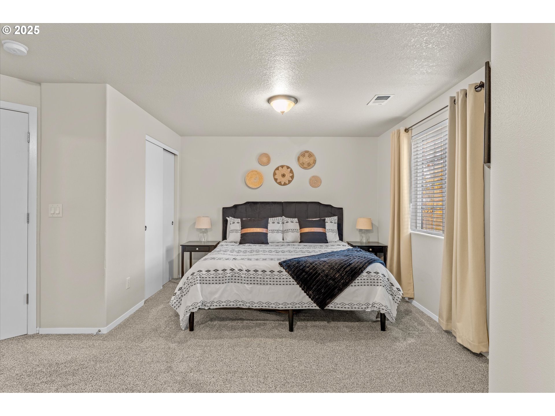 3019 Brooke Street Forest Grove, OR 97116 - Photo 17 of 34 a spacious bedroom with a bed and window