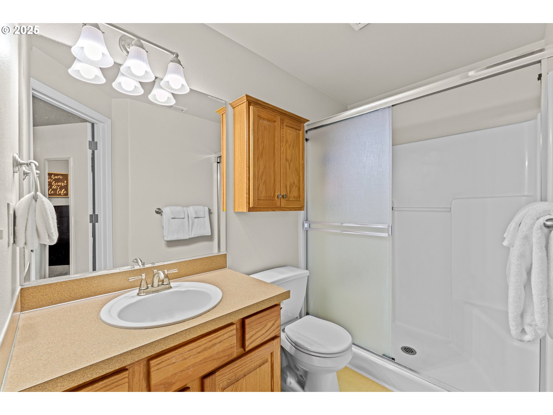 3019 Brooke Street Forest Grove, OR 97116 - Photo 19 of 34 a bathroom with a sink toilet a mirror and shower