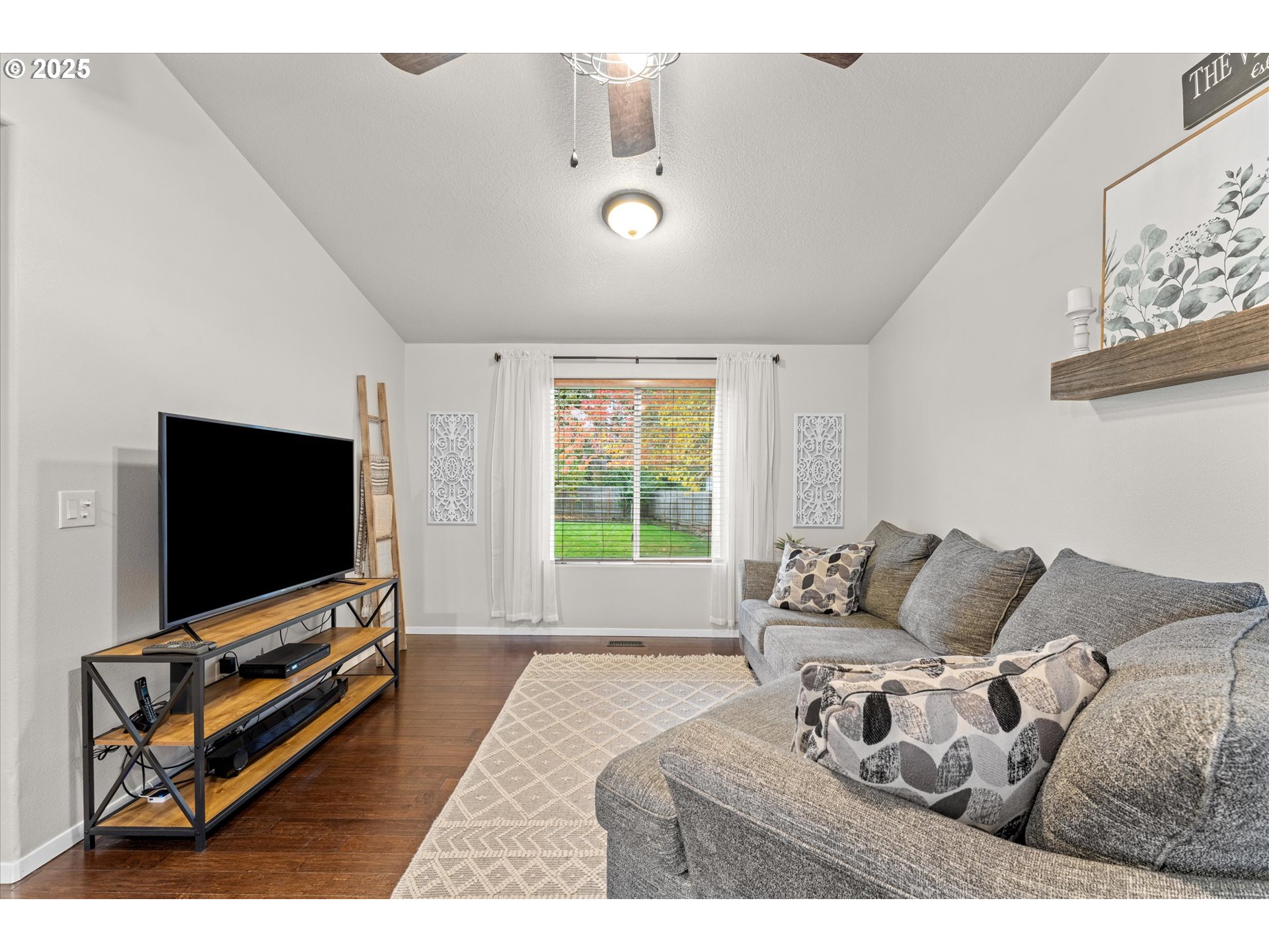 3019 Brooke Street Forest Grove, OR 97116 - Photo 7 of 34 a living room with furniture and a flat screen tv