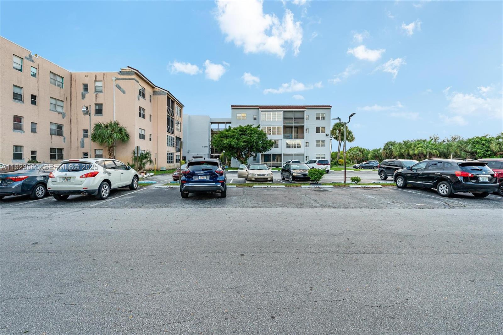 2840 Somerset Drive, Unit 207M Lauderdale Lakes, FL 33311 - Photo 10 of 25 a cars parked in front of a building