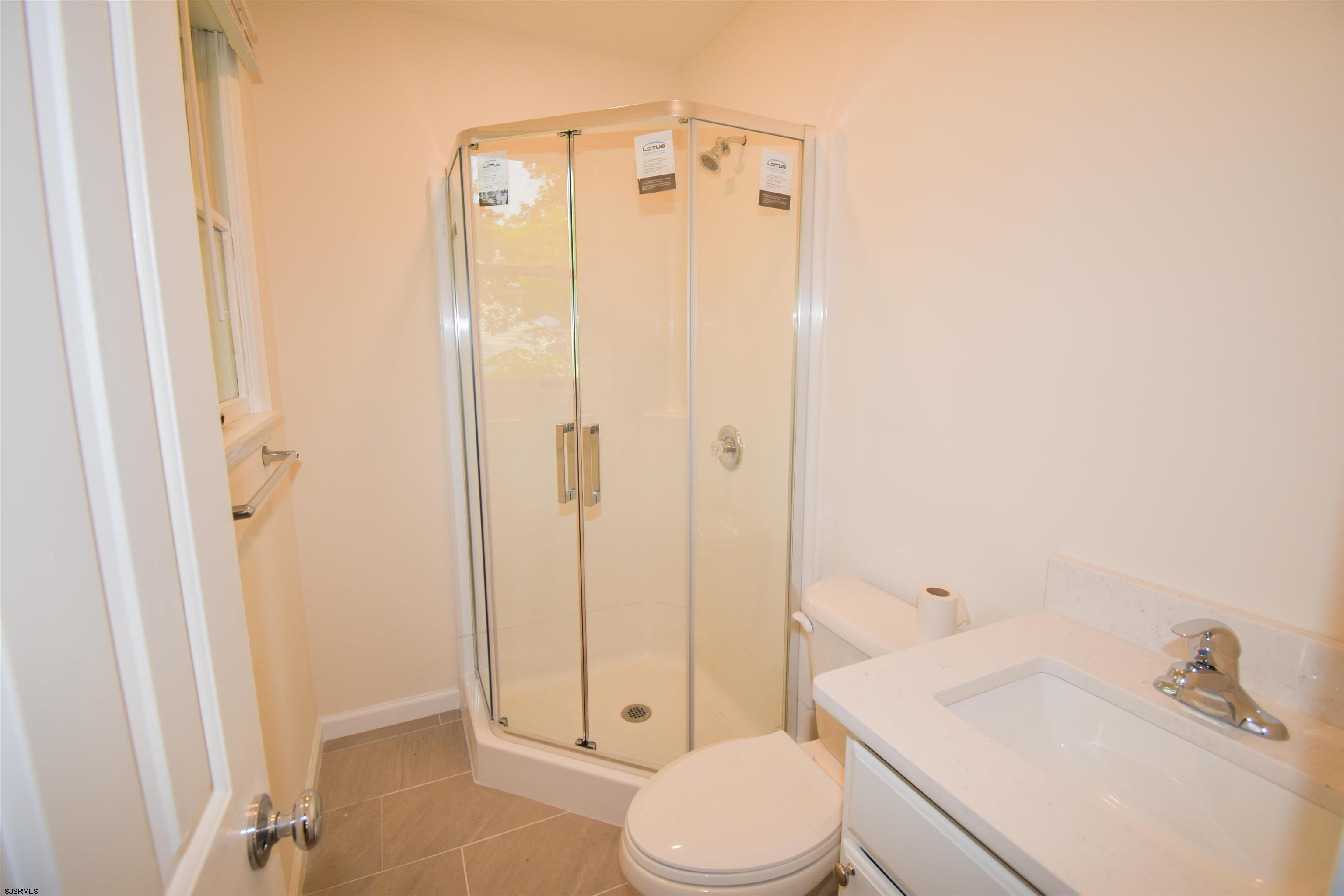 600 Stagecoach Road Marmora, NJ 08223 - Photo 16 of 29 a bathroom with a sink a toilet and shower