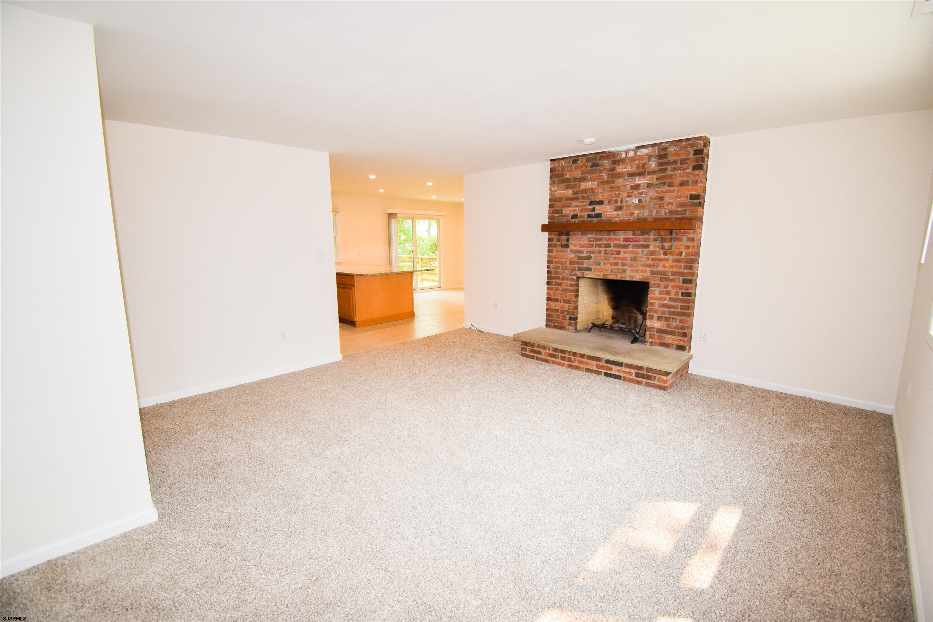 600 Stagecoach Road Marmora, NJ 08223 - Photo 2 of 29 a view of empty room with a fireplace