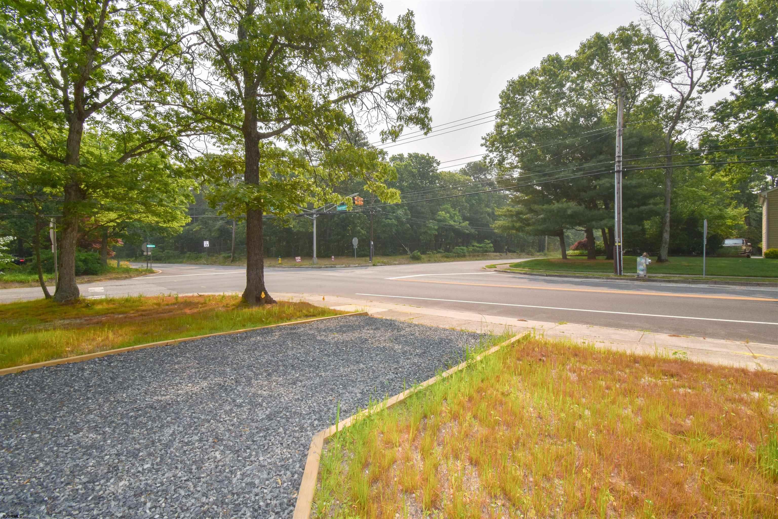 600 Stagecoach Road Marmora, NJ 08223 - Photo 27 of 29 a view of a swimming pool with a slide and trees