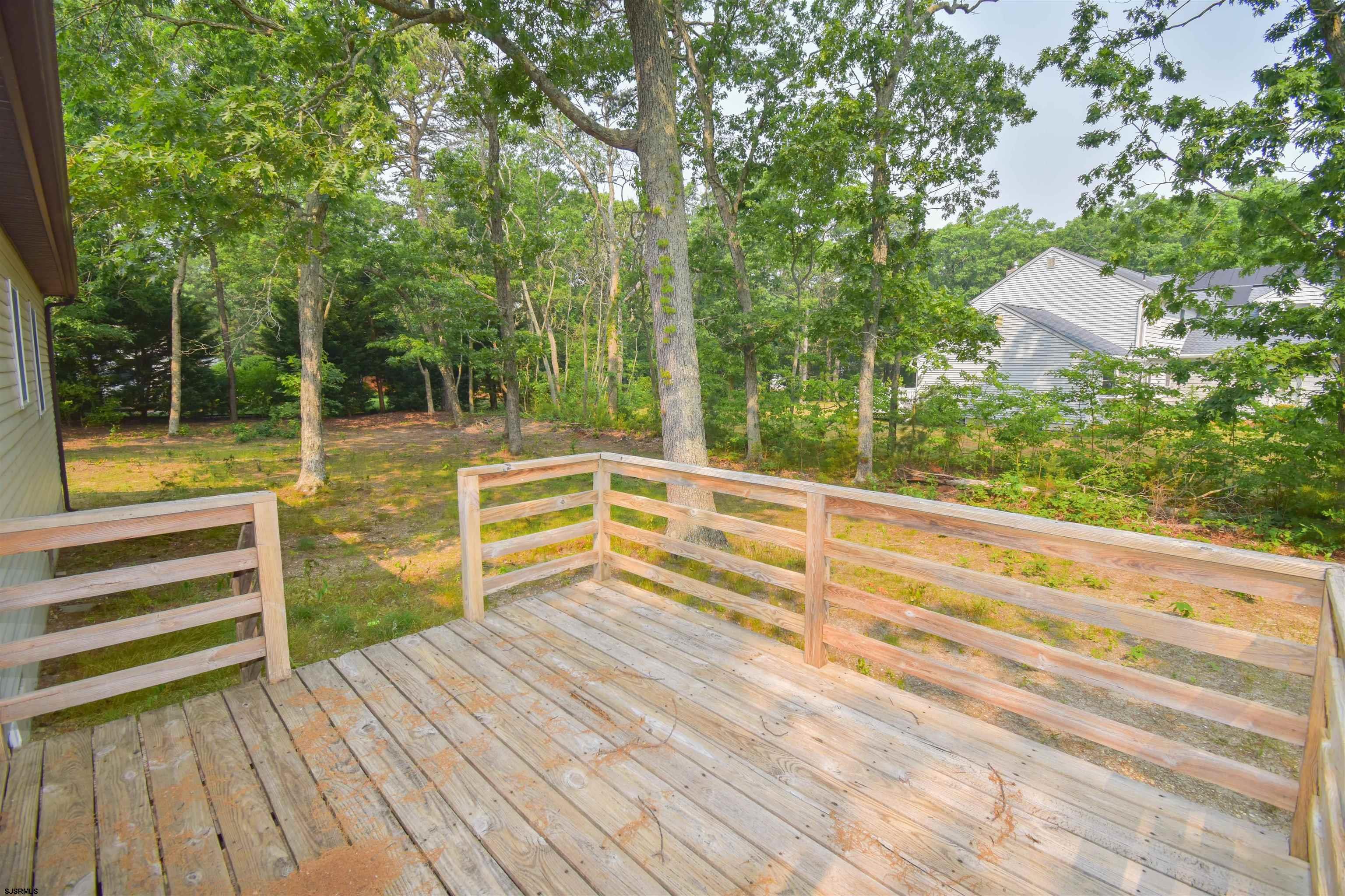 600 Stagecoach Road Marmora, NJ 08223 - Photo 8 of 29 a view of deck with two chairs and wooden floor