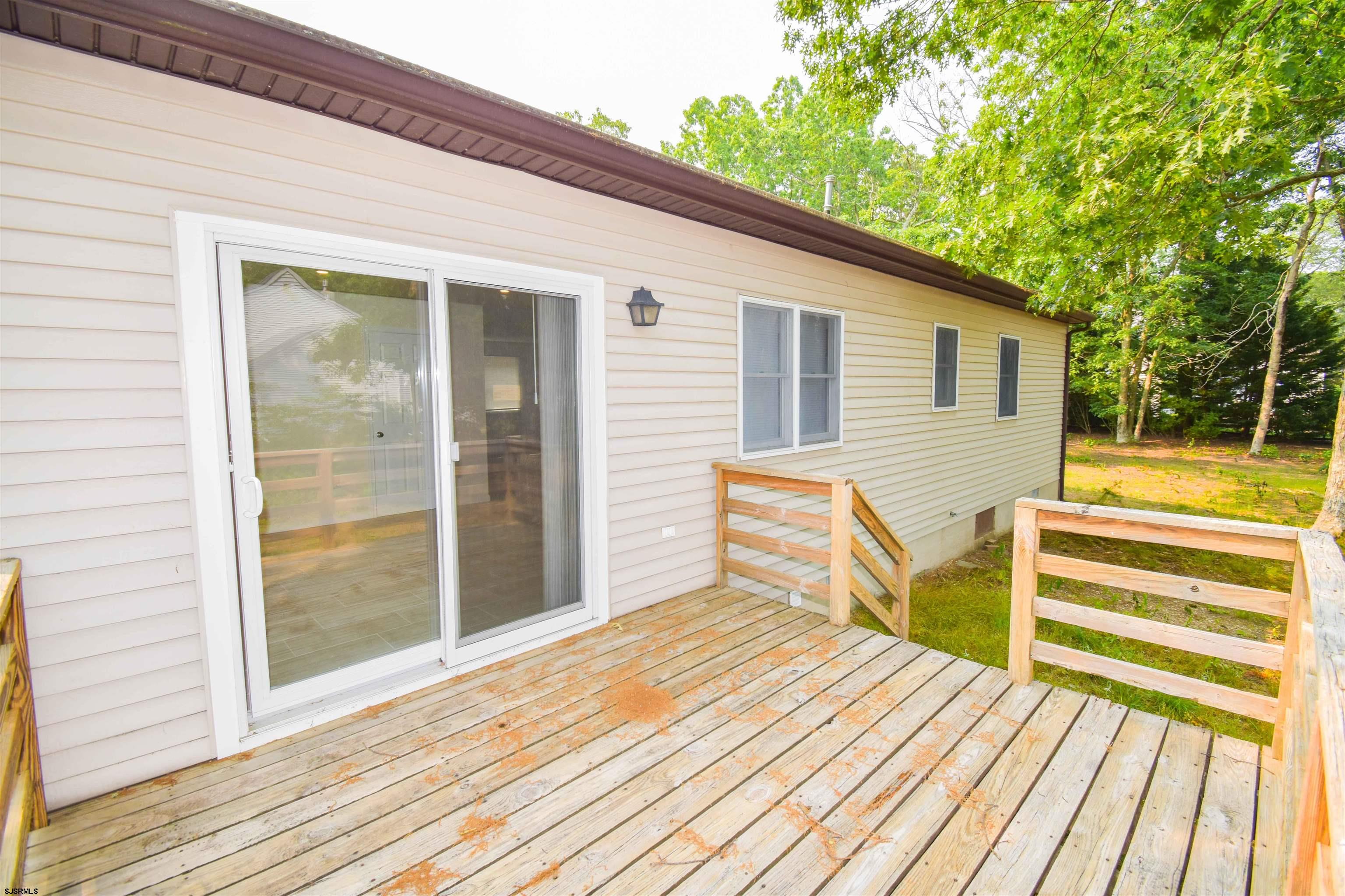600 Stagecoach Road Marmora, NJ 08223 - Photo 9 of 29 a view of a house with a patio