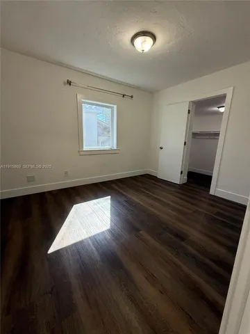 an entryway of a house with wooden floor