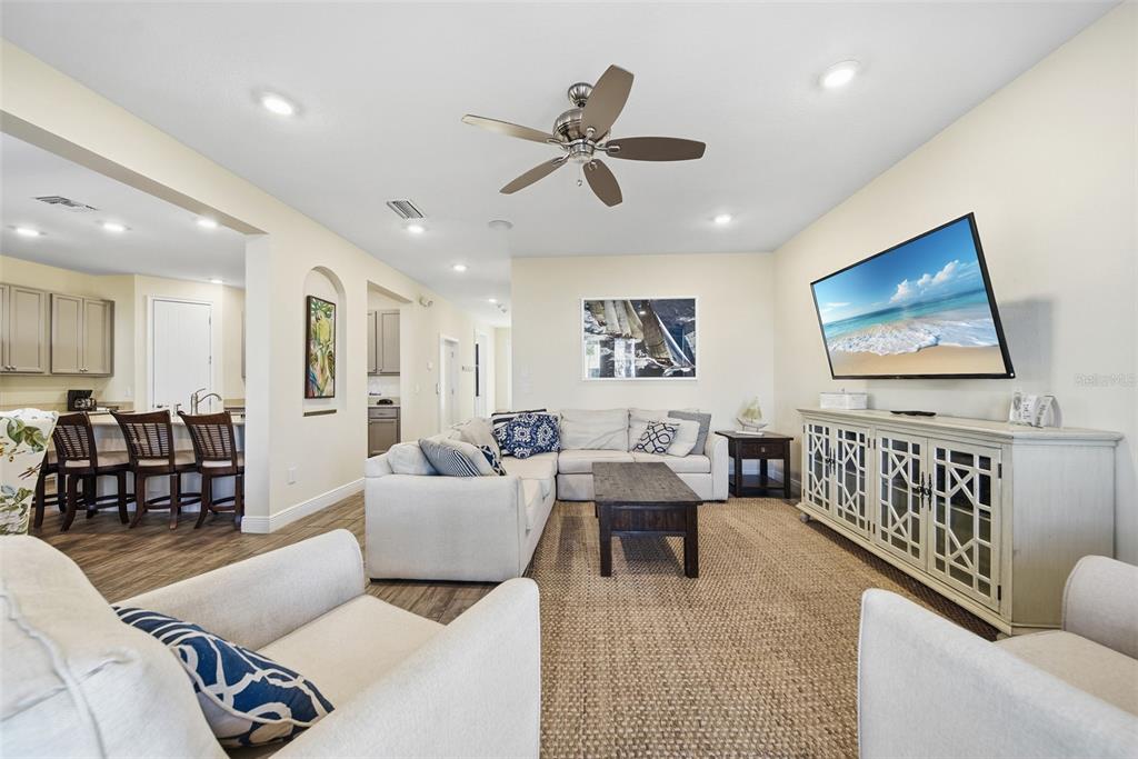 8017 Surf Street Kissimmee, FL 34747 - Photo 15 of 64 a living room with furniture and a flat screen tv