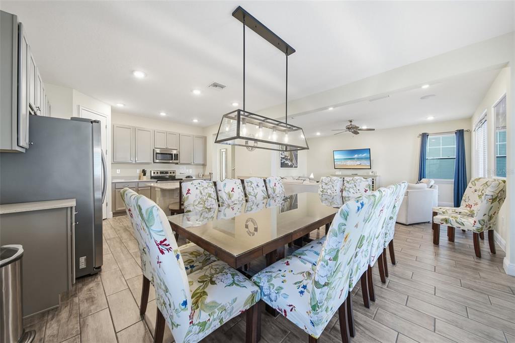 8017 Surf Street Kissimmee, FL 34747 - Photo 20 of 64 a view of a dining room with furniture
