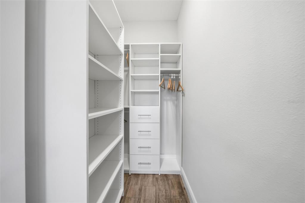 8017 Surf Street Kissimmee, FL 34747 - Photo 37 of 64 a view of walk in closet with empty racks