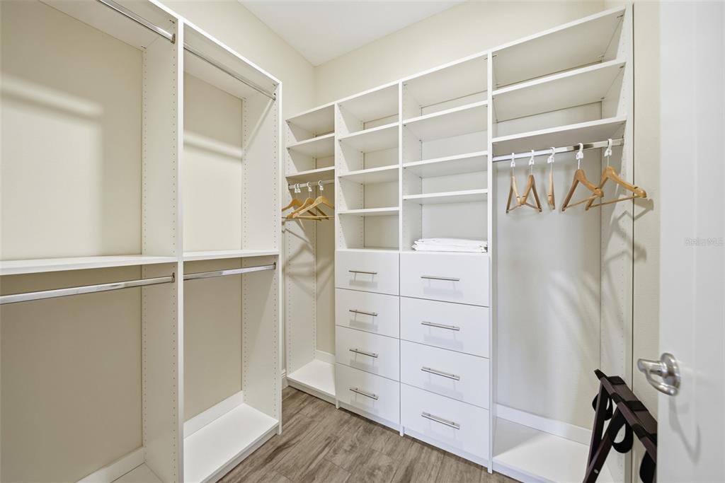 8017 Surf Street Kissimmee, FL 34747 - Photo 47 of 64 a view of walk in closet with empty racks