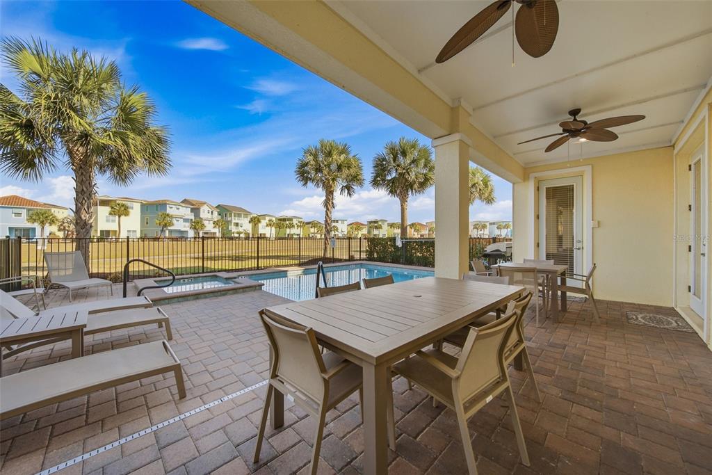 8017 Surf Street Kissimmee, FL 34747 - Photo 54 of 64 a view of a patio with swimming pool
