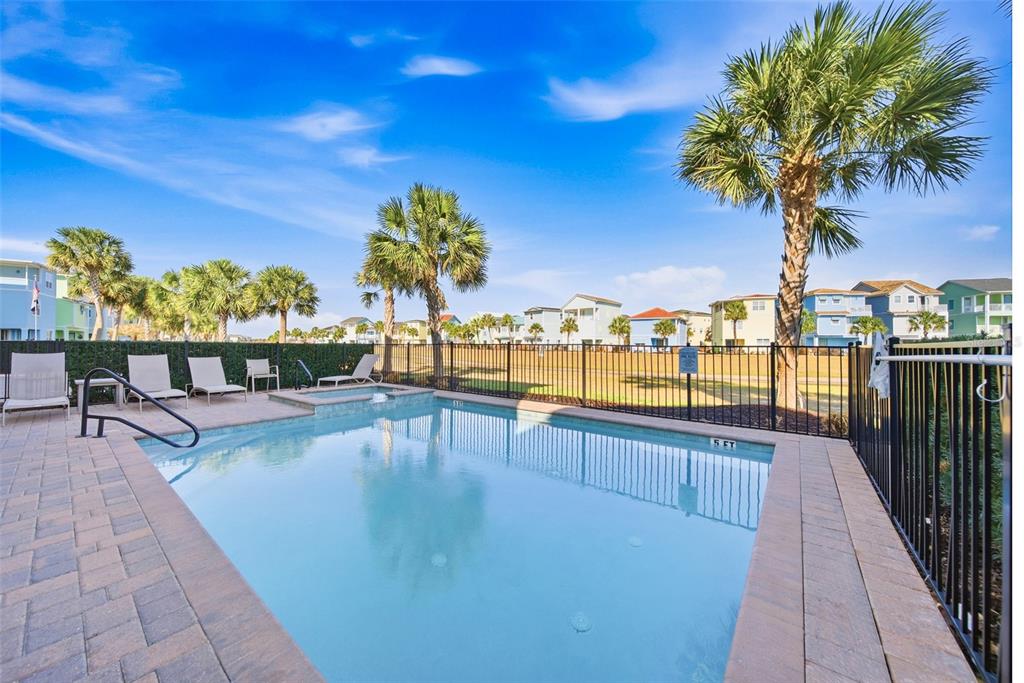 8017 Surf Street Kissimmee, FL 34747 - Photo 56 of 64 a view of swimming pool with outdoor seating and city view