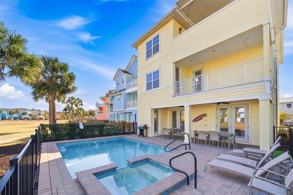 8017 Surf Street Kissimmee, FL 34747 - Photo 57 of 64 a view of a patio with swimming pool table and chairs