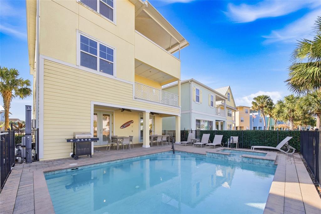8017 Surf Street Kissimmee, FL 34747 - Photo 58 of 64 a view of a swimming pool with outdoor seating