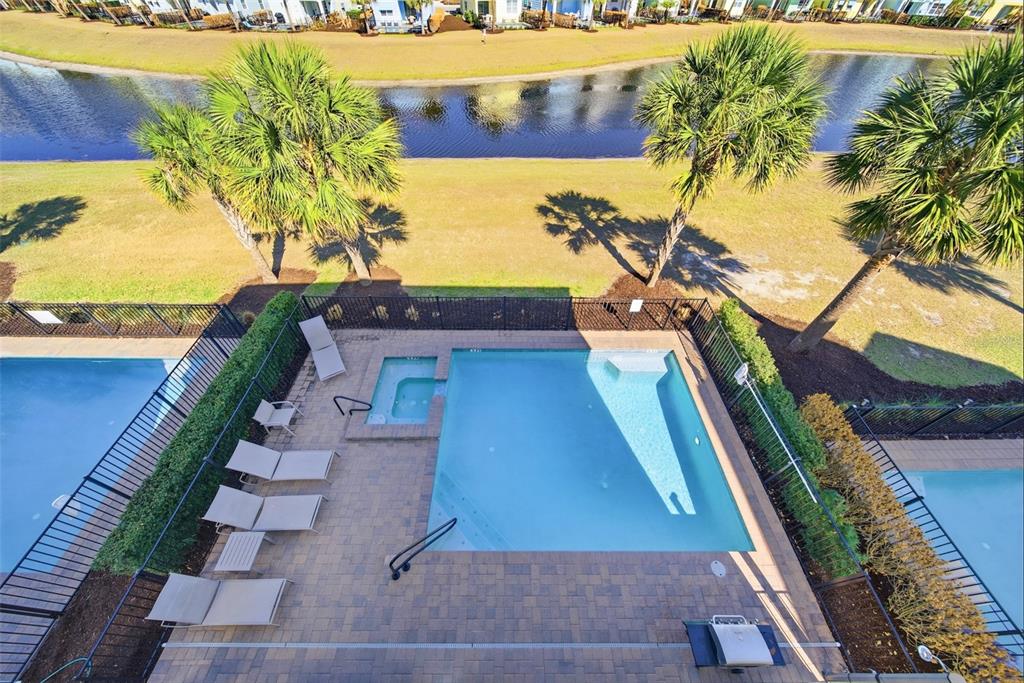 8017 Surf Street Kissimmee, FL 34747 - Photo 61 of 64 a view of an outdoor space with a swimming pool