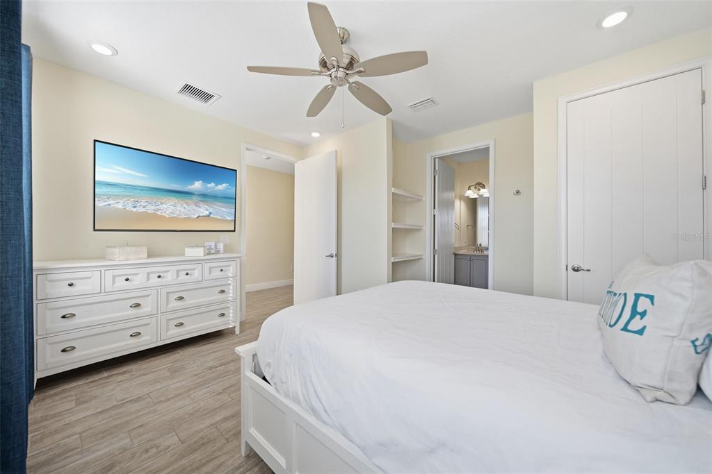 8017 Surf Street Kissimmee, FL 34747 - Photo 9 of 64 a bedroom with a bed and a dresser