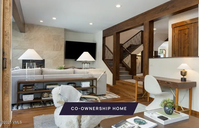 a view of living room with furniture and wooden floor