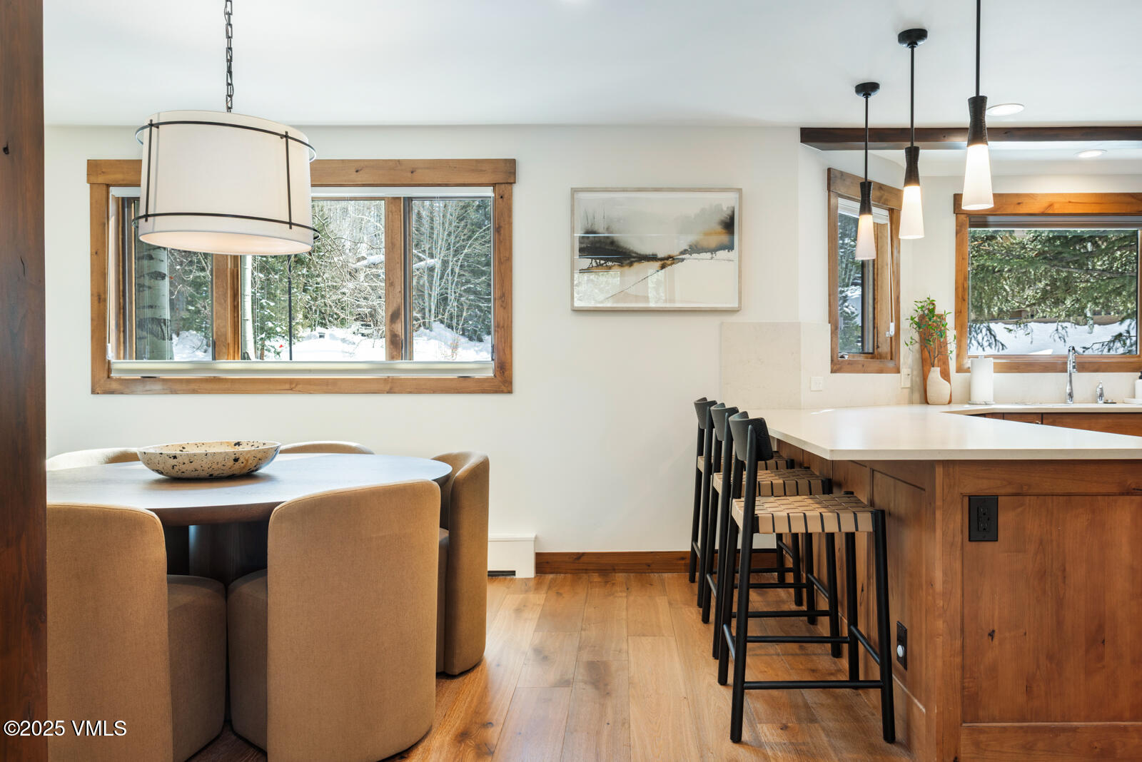 1670 Fallridge Place, Unit C11 Vail, CO 81657 - Photo 16 of 39 a dining room with furniture a chandelier and wooden floor