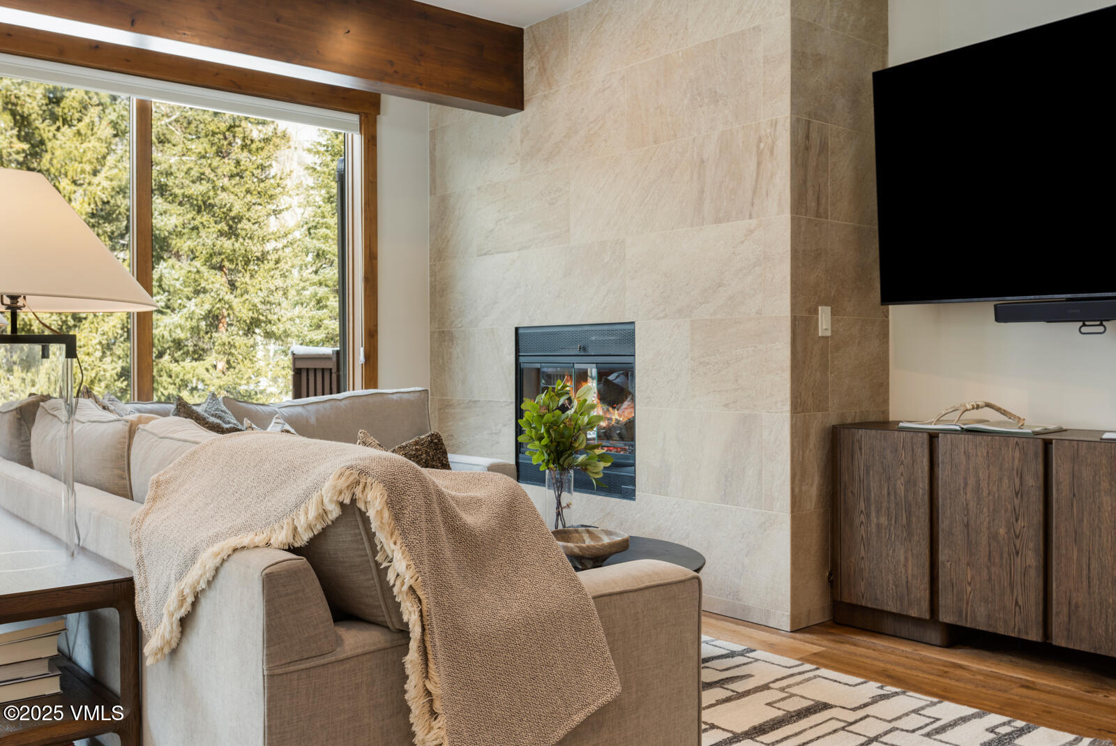 1670 Fallridge Place, Unit C11 Vail, CO 81657 - Photo 18 of 39 a living room with furniture a flat screen tv and a window