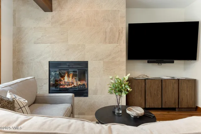 a living room with furniture and a flat screen tv