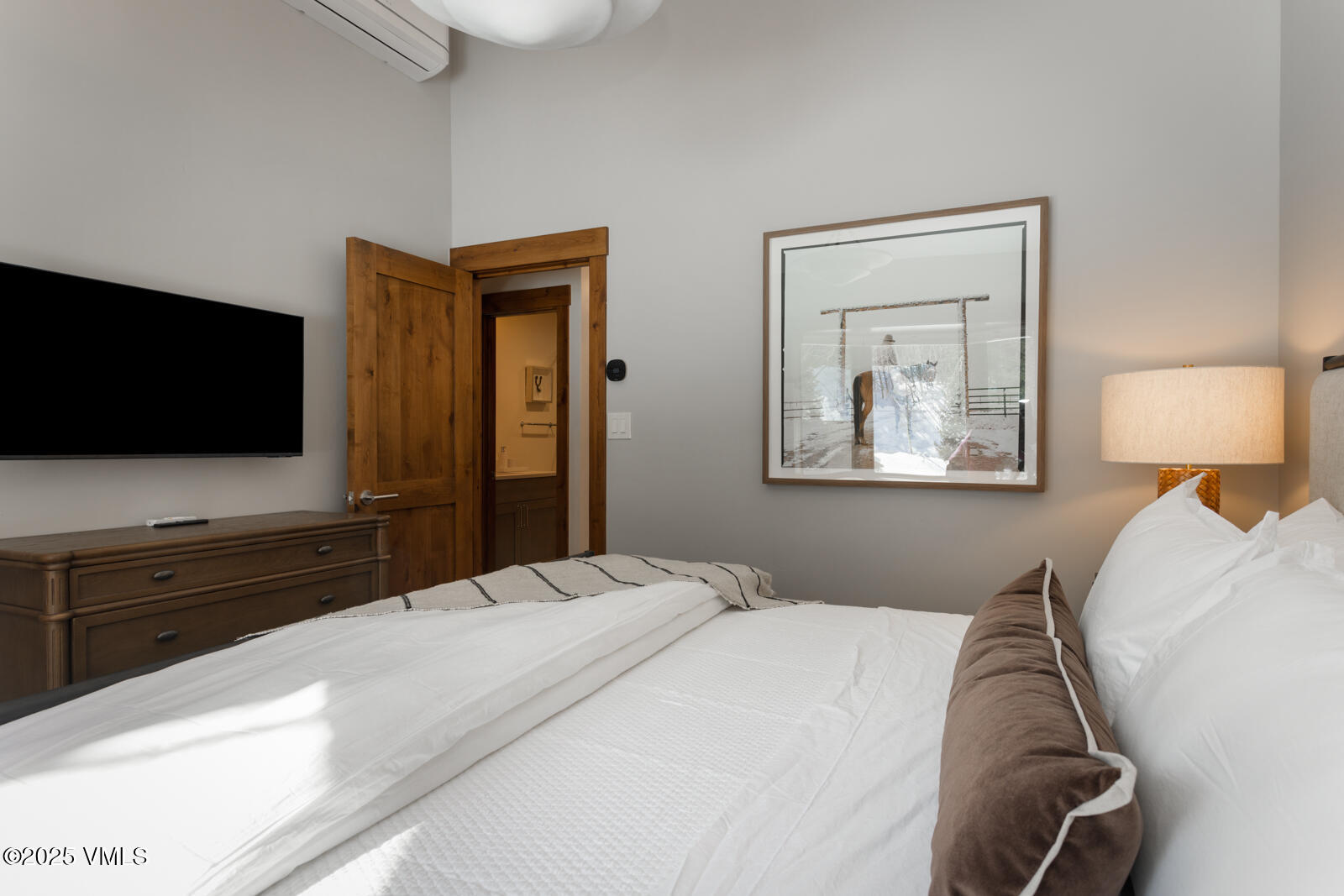 1670 Fallridge Place, Unit C11 Vail, CO 81657 - Photo 25 of 39 a bedroom with a bed and a flat screen tv