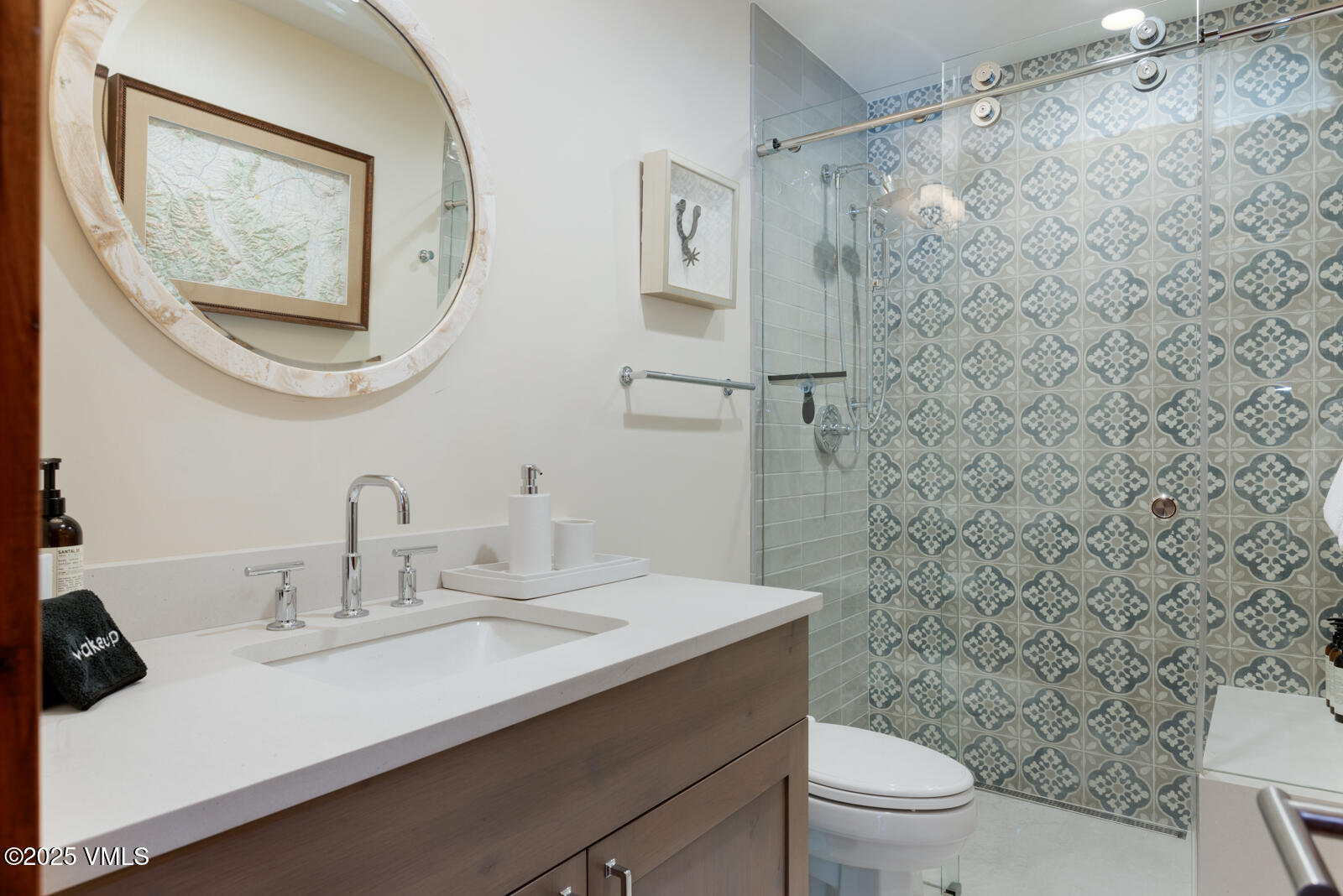 1670 Fallridge Place, Unit C11 Vail, CO 81657 - Photo 26 of 39 a bathroom with a sink mirror and toilet