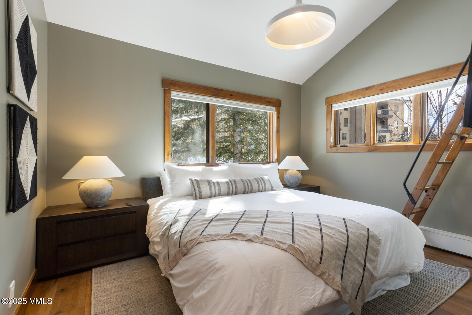 1670 Fallridge Place, Unit C11 Vail, CO 81657 - Photo 28 of 39 a bedroom with a bed and wooden floor
