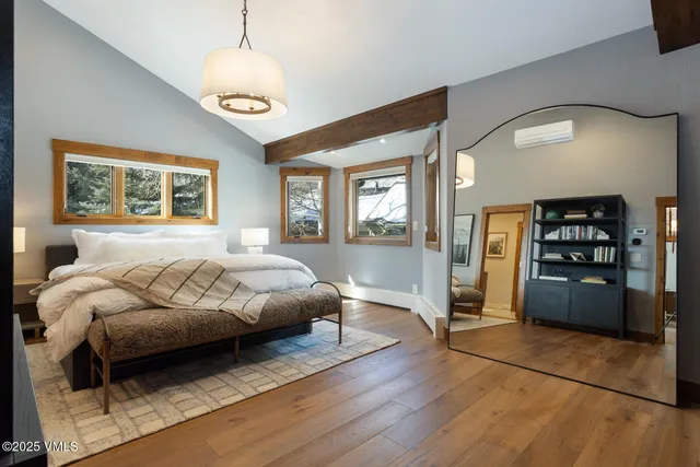 a bedroom with a bed and window