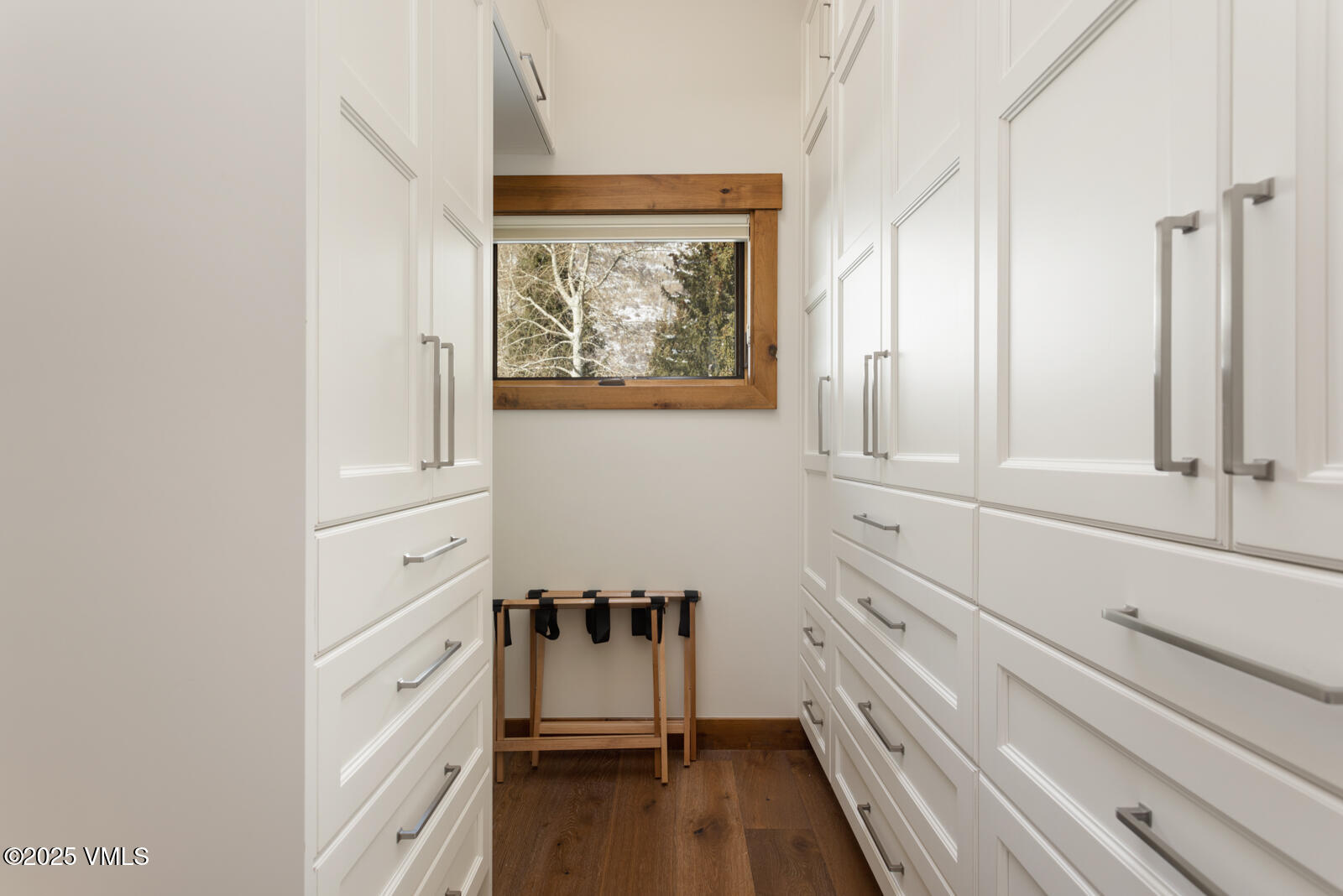 1670 Fallridge Place, Unit C11 Vail, CO 81657 - Photo 31 of 39 a view of a bedroom with wooden floor and cabinet