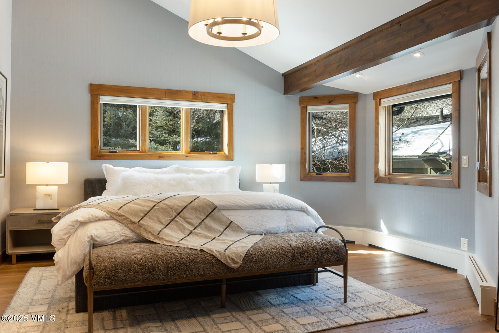 1670 Fallridge Place, Unit C11 Vail, CO 81657 - Photo 32 of 39 a bedroom with a bed and wooden floor