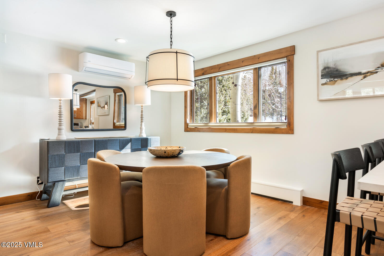 1670 Fallridge Place, Unit C11 Vail, CO 81657 - Photo 4 of 39 a dining room with furniture a window and wooden floor