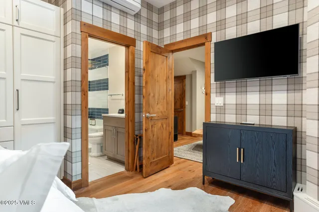 a view of living room kitchen with furniture and flat screen tv