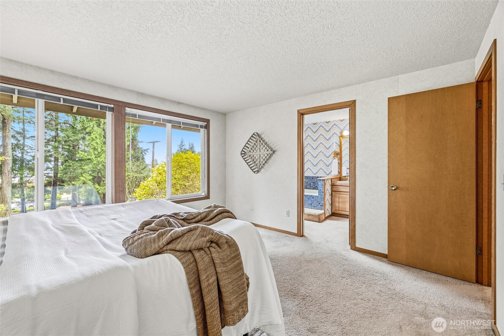 601 Clark Road Bellingham, WA 98225 - Photo 18 of 38 a bed sitting in a bedroom next to a window