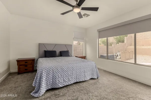 a bedroom with a bed and window