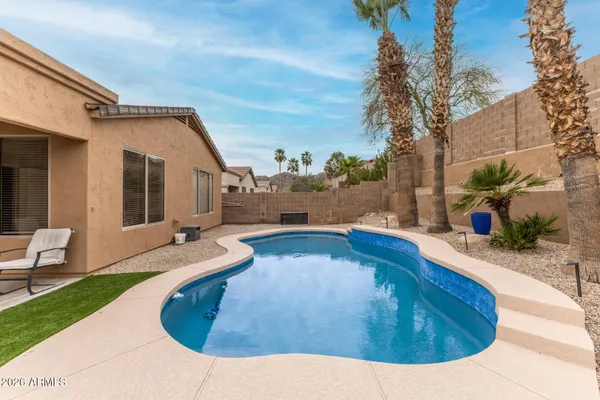 a view of a house with swimming pool