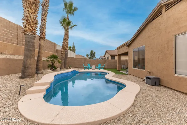 a view of a swimming pool with a patio