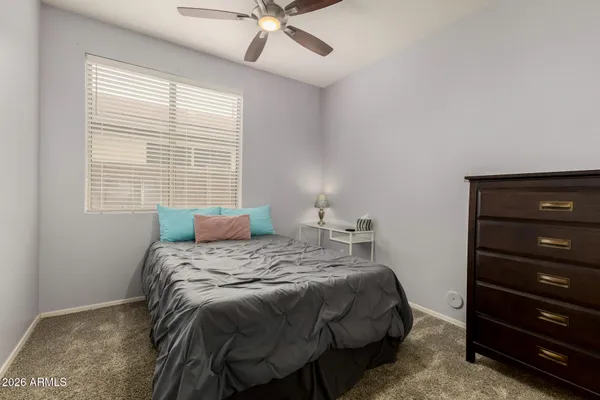 a bedroom with a bed and a closet