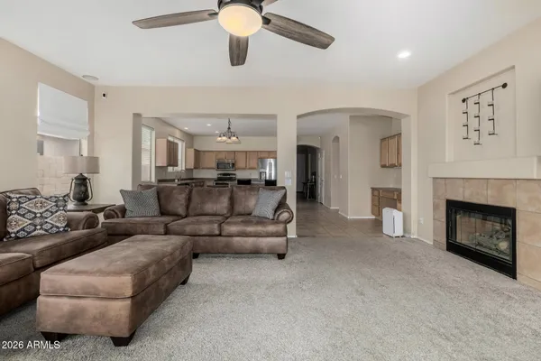 a living room with furniture and a fireplace