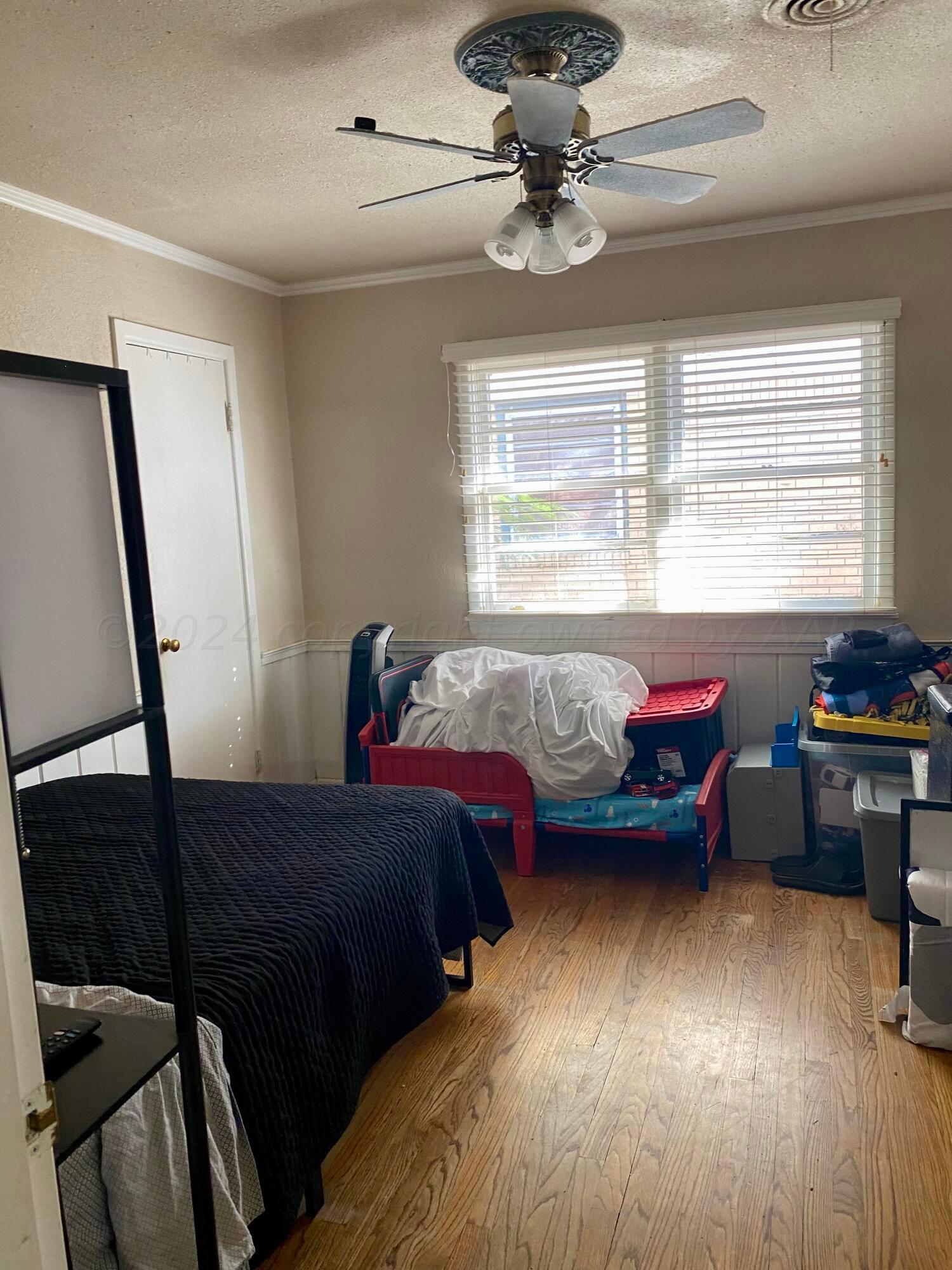 3309 Paramount Boulevard Amarillo, TX 79109 - Photo 13 of 26 a bed room with a bed and a window