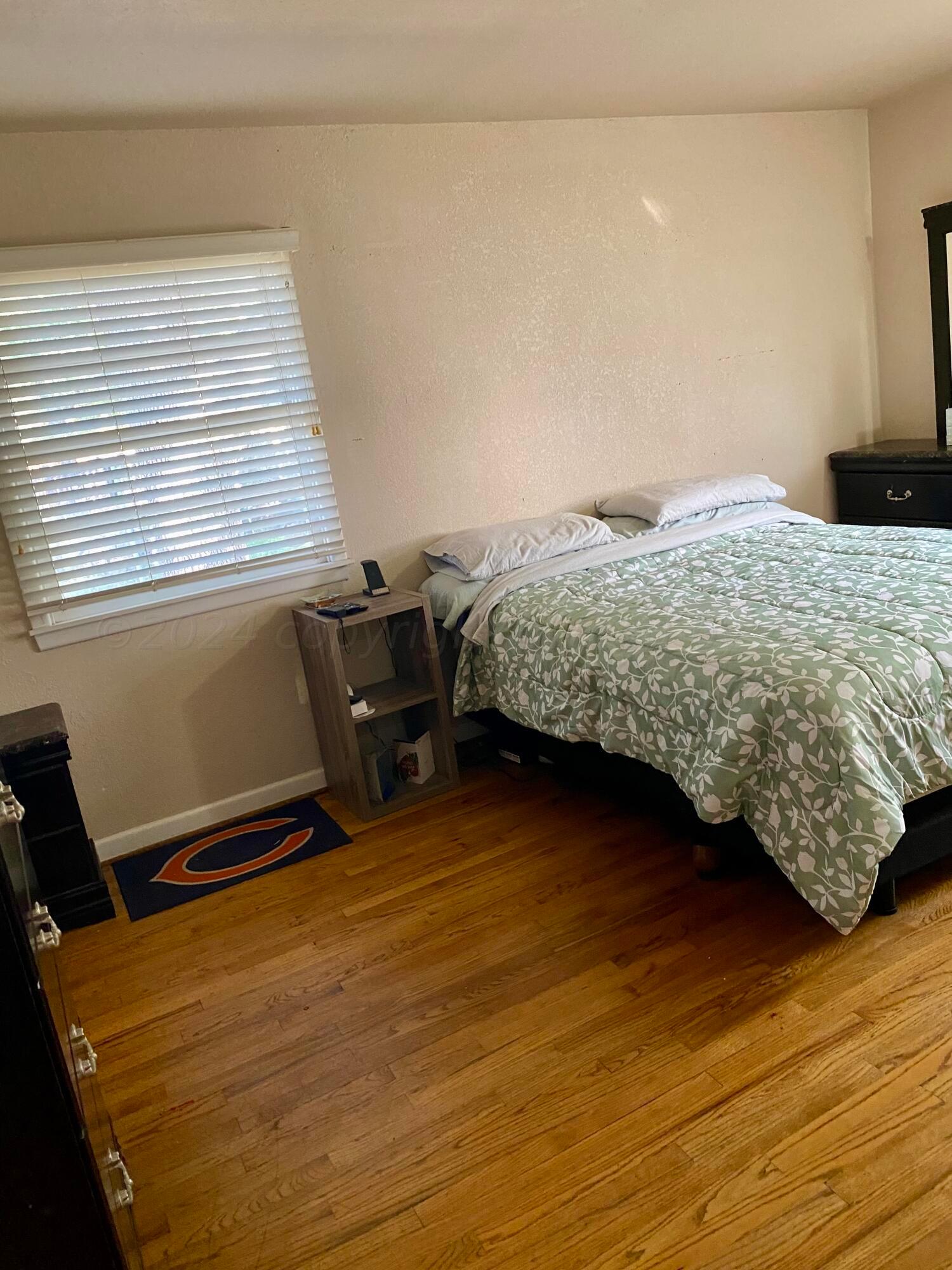 3309 Paramount Boulevard Amarillo, TX 79109 - Photo 15 of 26 a bedroom with a bed and a window