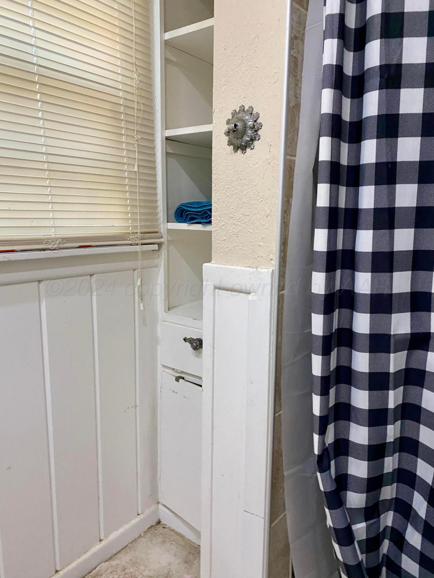 3309 Paramount Boulevard Amarillo, TX 79109 - Photo 17 of 26 a view of bathroom with a shower and a sink
