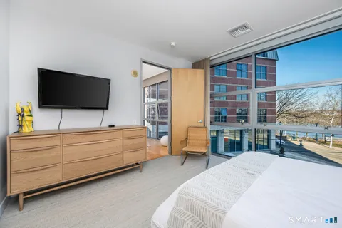 a room with furniture and flat screen tv