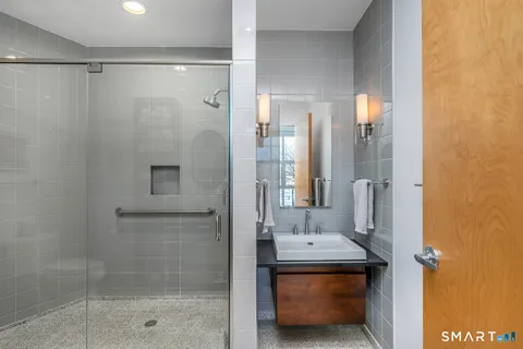 a bathroom with a shower and a sink