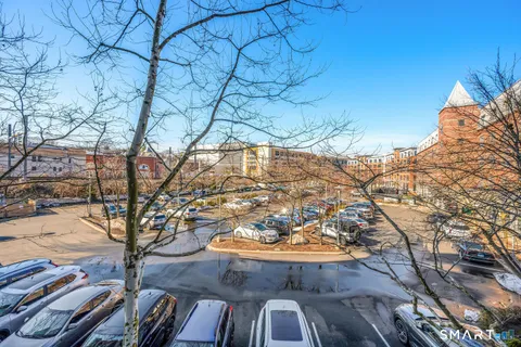 a view of a street with cars
