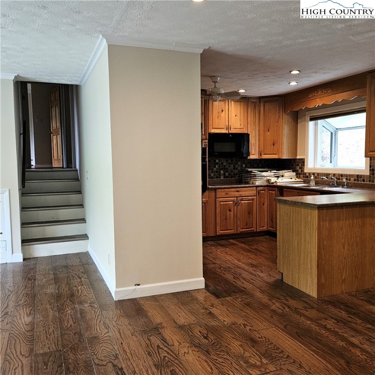 139 Charles Street Boone, NC 28607 - Photo 21 of 49 a kitchen with stainless steel appliances granite countertop a stove a sink and a refrigerator