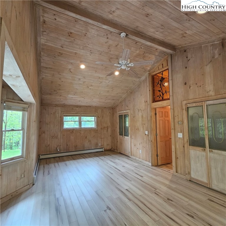 139 Charles Street Boone, NC 28607 - Photo 28 of 49 an empty room with wooden floor and windows