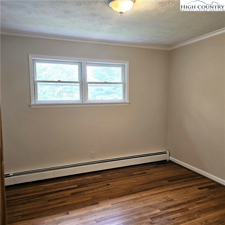139 Charles Street Boone, NC 28607 - Photo 31 of 49 wooden floor in an empty room with a window